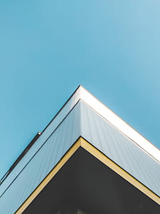 white concrete building under blue sky thumbnail