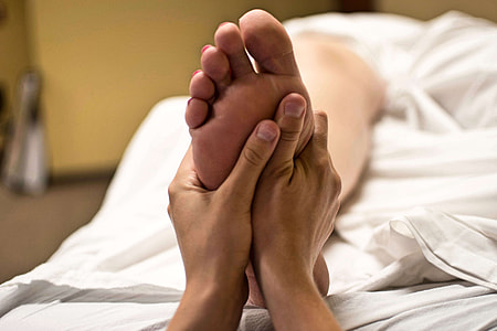 photo of person pressing person's foot thumbnail