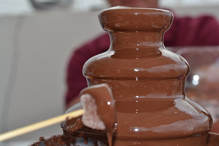 tilt-shift lens photo of brown chocolate fountain thumbnail