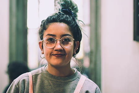 woman in gray crew-neck top and wearing clear eyeglasses shallow focus photography thumbnail