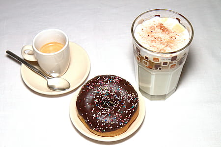 chocolate donut on saucer; cup of milkshake; and cup of coffee with spoon on saucer thumbnail