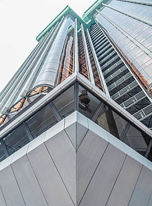 worm's-eye-view photo of gray and clear glass building thumbnail