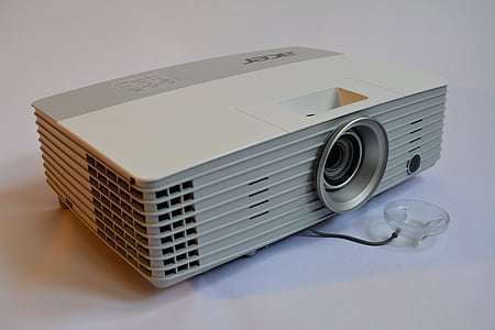 white and gray LED projector on table thumbnail