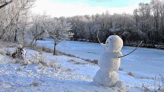 white snowman on snow field thumbnail