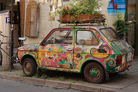 multicolored coupe parked outside thumbnail