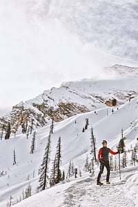 man treking on snow mountain thumbnail