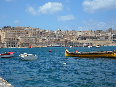 yellow boat on body of water thumbnail