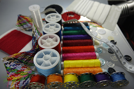 assorted-color thread lot on surface thumbnail
