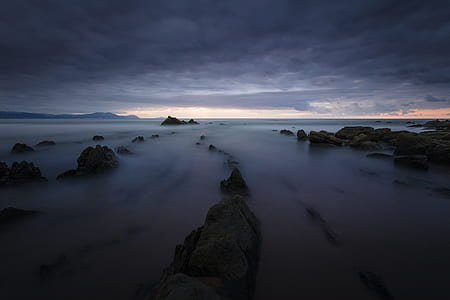 rock formation covered with fogs at morning thumbnail