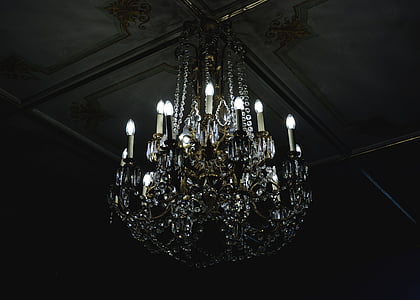 clear uplight chandelier on gray ceiling thumbnail