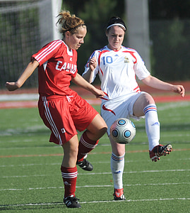 woman kicking soccer ball thumbnail