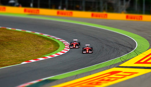 two racing cars on race track thumbnail