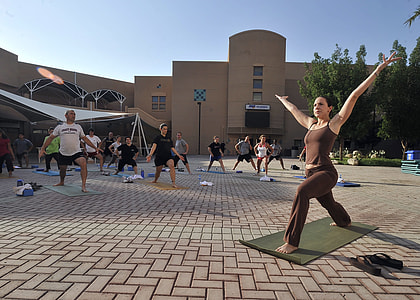 group of people performing a morning yoga at the park thumbnail
