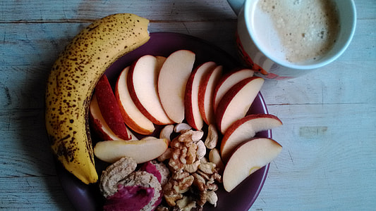 ripe banana and sliced apple beside coffee thumbnail