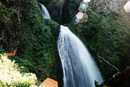 low angle photo of waterfall taken at daytime thumbnail