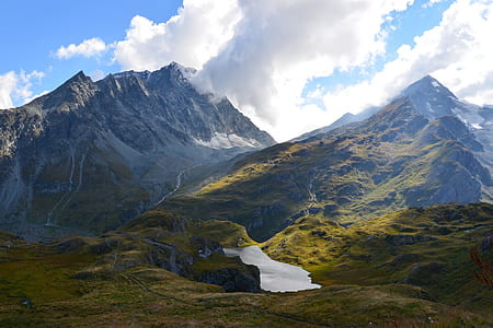 mountain under white cloudy sky during daytime thumbnail