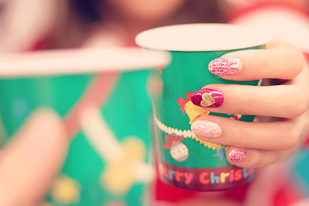 person holding green disposable cup thumbnail