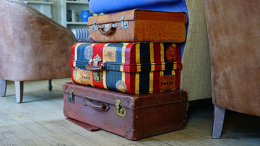three assorted-color luggage bags thumbnail