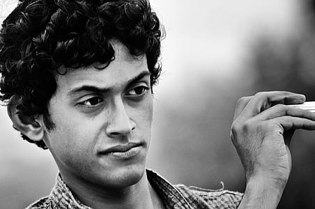 grayscale photography of man wearing polo shirt thumbnail