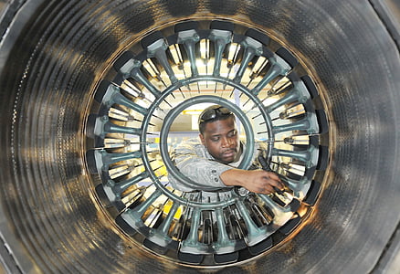 man holding flashlight pointing on gray surface thumbnail