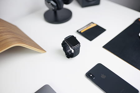 Apple Watch near space gray iPhone X on table thumbnail