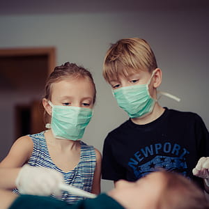 Two Children Wearing Surgical Masks thumbnail