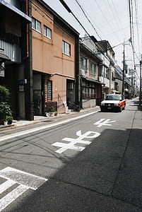 white and red taxi cab on asphalt road thumbnail