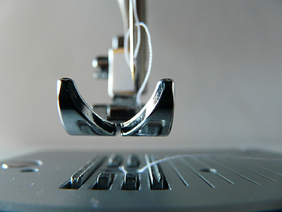 shallow focus photography of sewing machine part thumbnail