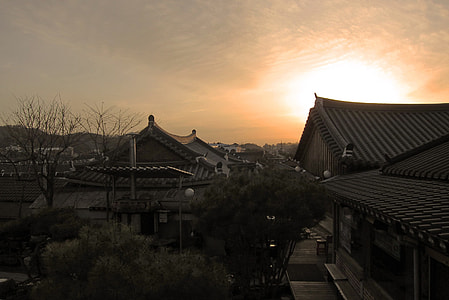 close-up photo of grey roof houses under sunset thumbnail