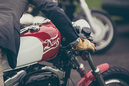 man riding white and red standard motorcycle thumbnail