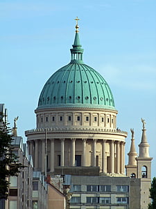 beige and teal concrete dome building during daytime thumbnail