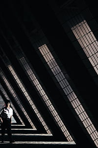 man walking near windows thumbnail