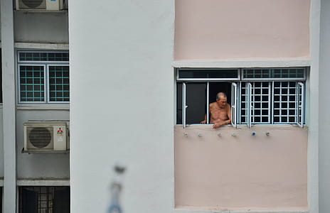 Man Looking Through Window thumbnail