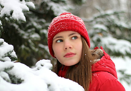 woman wearing red knit cap and red hooded jacket thumbnail