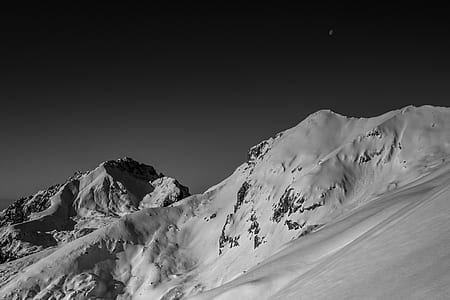 snow capped mountains at nighttime thumbnail