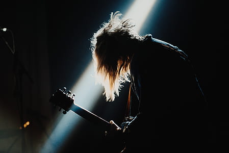 man holding a electric guitar thumbnail