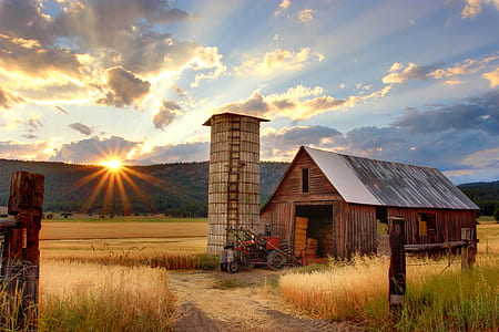 brown wooden house during sunrise thumbnail