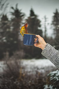 woman raising her ceramic mug thumbnail