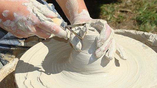 person carving clay thumbnail