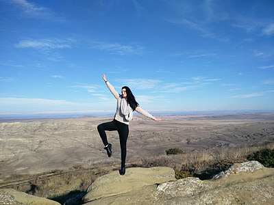 woman standing in cliff thumbnail