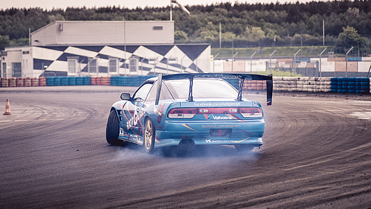 drifting blue Mazda RX-7 coupe during daytime thumbnail