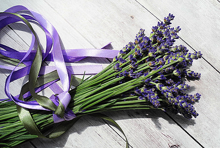 bouquet of lavender flowers on top of gray wooden surface thumbnail