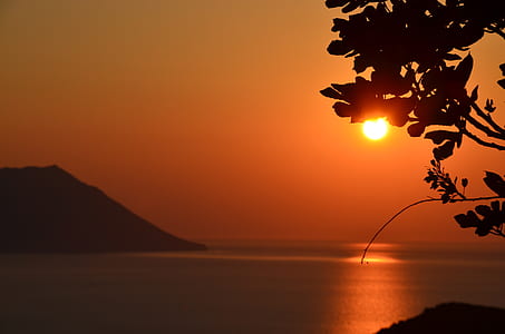 golden hour over body of water thumbnail