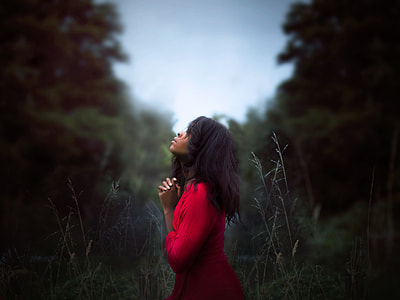 black haired woman in red dress focus photography thumbnail