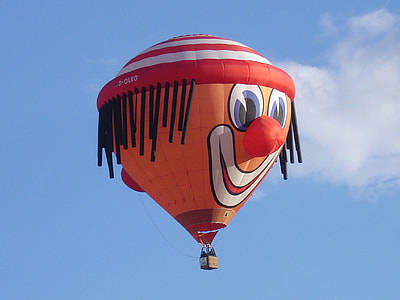 flying orange and red hot air balloon thumbnail