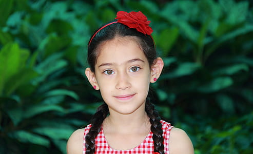 selective focus photography of girl wearing red alice band thumbnail