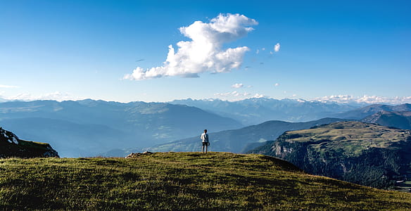 person on plain under white and blue sky at daytime thumbnail