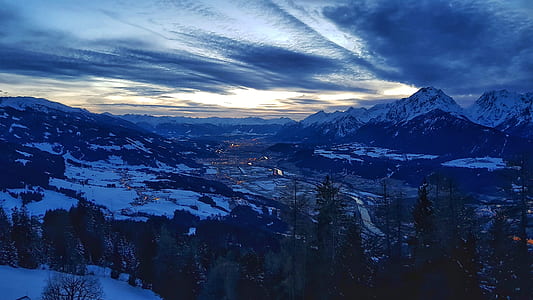 aerial photography of village near mountain during nighttime thumbnail