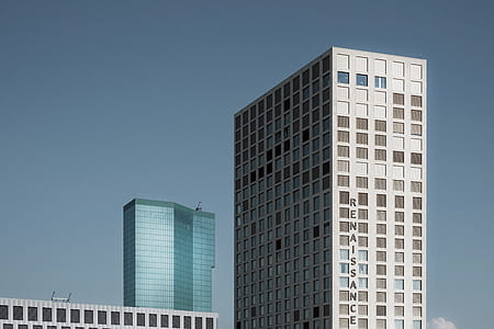 two white and green high-rise buildings thumbnail
