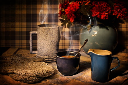 blue ceramic mug full of coffee on table thumbnail